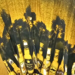 Men's button down short sleeve shirt with pocket pictures of beer bottles